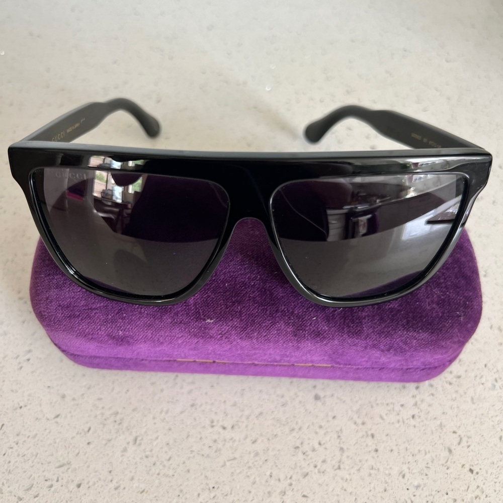 Gucci sunglasses in great condition no scratches .